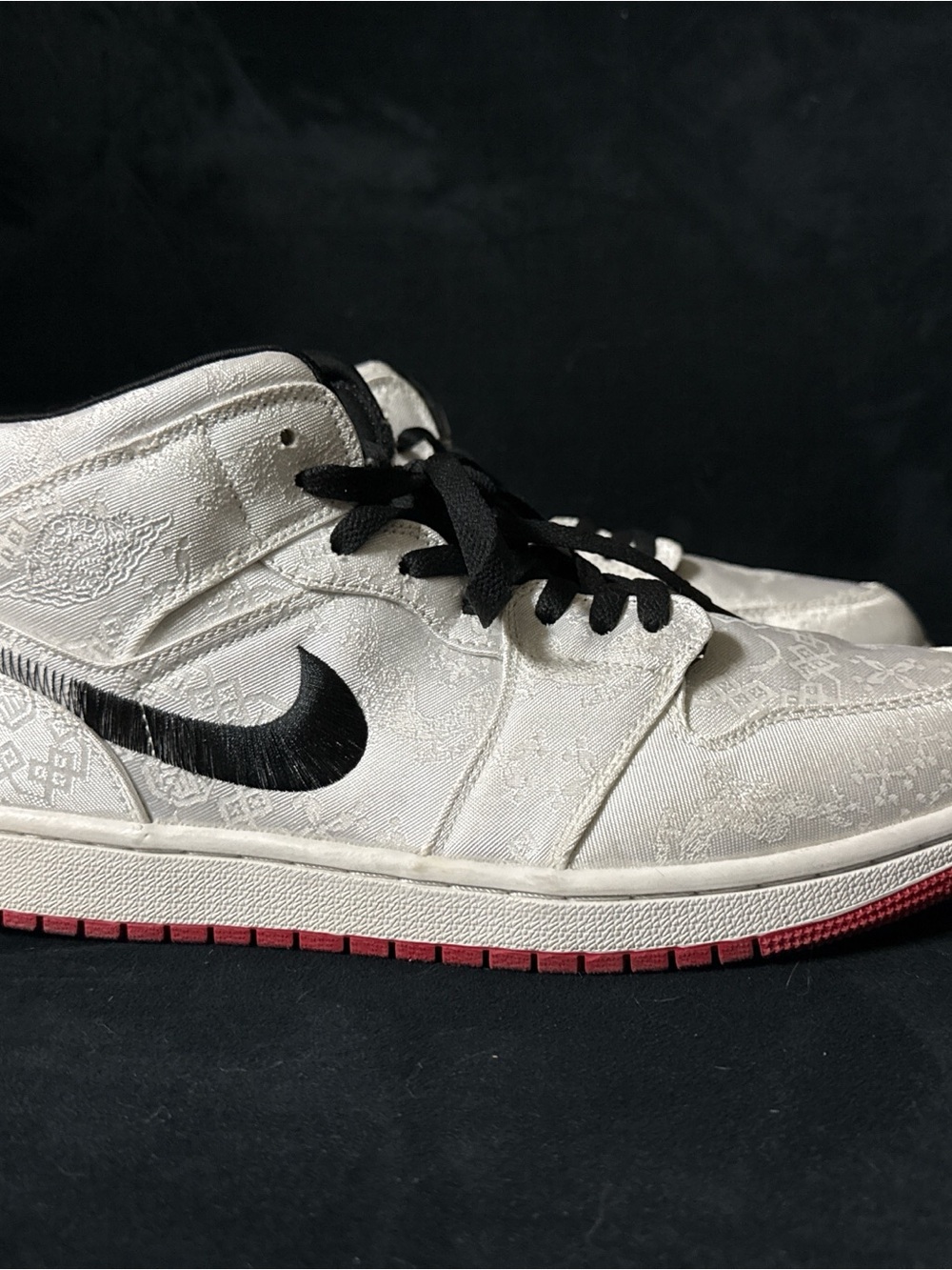 Nike White and Black Sneakers with Red Outsole and fabric filigree embroidery